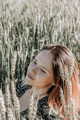 Russian girl in a field with wheat - here she is real freedom