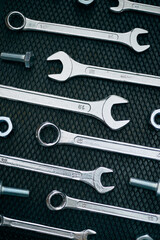 Set of chrome wrenches on steel surface. Mechanic tools for maintenance. Hardware tools to fix