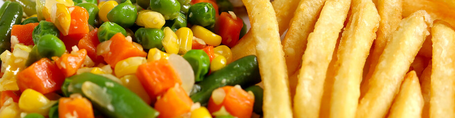 French Fries and vegetables ready to eat - close up background