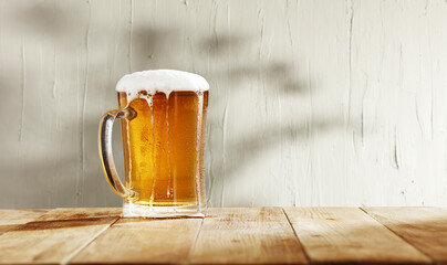 Fresh cold beer and wall with shadows 