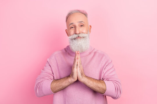 Photo of optimistic grey hair old man hold hands wear pink sweater isolated on pastel color background
