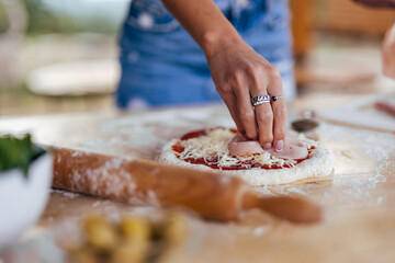 Fresh ham, decorating the top of the pizza.