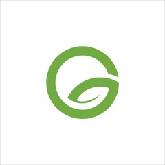 Letter G logo with green leaves.
