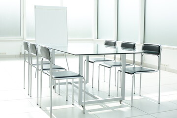 Flipchart glass table and chairs in office space