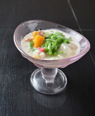 Thai style cold chendol bobo chacha green ruby dessert in glass on wood background asian dessert menu