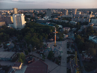 Attractions recreation area in sunset light. Aerial evening view in Kharkiv city center Park of Maxim Gorky
