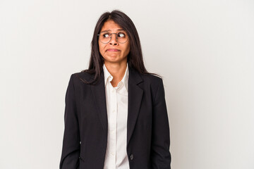 Young business latin woman isolated on white background confused, feels doubtful and unsure.