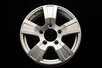 new silver alloy wheels for SUVs on black background