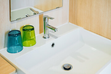 Modern Bathroom Sink Basin With two plastic glass.