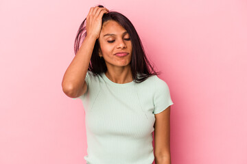Young latin woman isolated on pink background tired and very sleepy keeping hand on head.