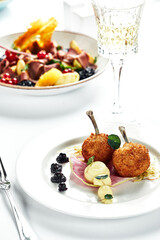 Chicken Kiev on a festive table, light background, white plate, copy space.