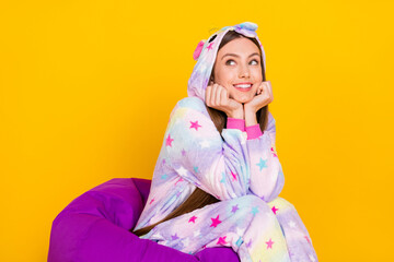Portrait of attractive cheery dreamy girl wearing animal clothes thinking fantasizing isolated over bright yellow color background