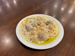 Turkish Yuvalama Soup with Yogurt and Chickpeas. Traditionak Organic Food at Local Restaurant.