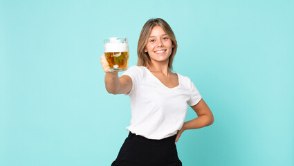 pretty young blonde woman holding a pint of beer
