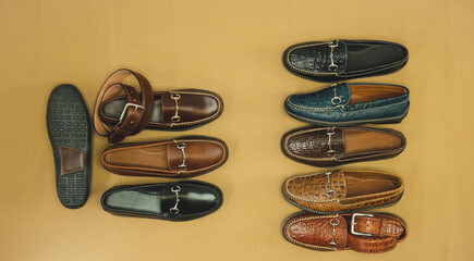 Many bit loafers shot as a flat lay with a matching belt. Men's shoe fashion.