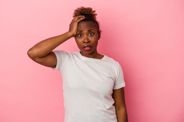 Young african american woman isolated on pink background being shocked, she has remembered important meeting.