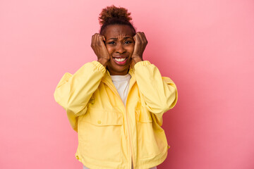 Young african american woman isolated on pink background crying, unhappy with something, agony and confusion concept.