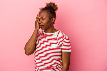 Young african american woman isolated on pink background having a head ache, touching front of the face.