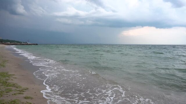dark storm clouds over the sea beach. Beaches without people