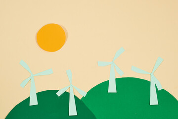 Wind turbines made of paper. Renewable energy, concept art. Wind farm.