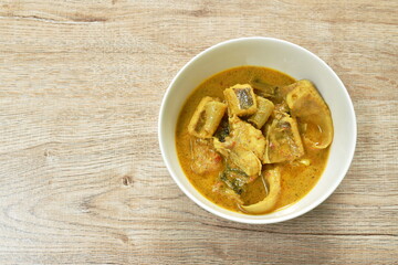 spicy spicy slice stingray fish in coconut milk curry on bowl