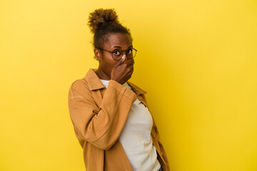 Fototapeta na wymiar Young african american woman isolated on yellow background scared and afraid.
