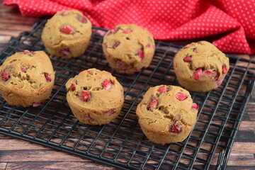 strawberry muffins on cooling rack