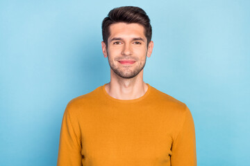 Photo of young handsome business man happy positive smile wear casual jumper isolated over blue color background