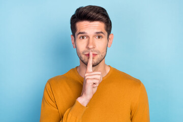 Photo of sweet adorable young guy dressed yellow pullover finger lips asking keep silence isolated...