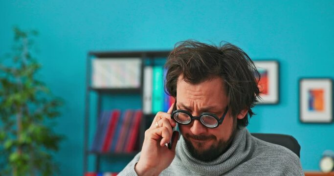 Funny man with big black round glasses, answers phone from customer, makes jokes, isn't well-informed, doesn't understand what is being said to him, keeps nodding, not anserwing for questions