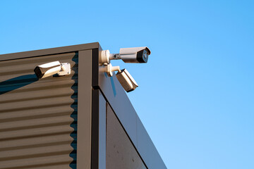Surveillance cameras building facade closeup. Electronic circuit. The concept of security.