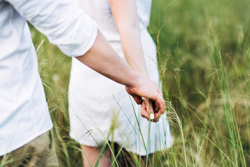 a guy with a girl in light clothes on the background of a green canyon
