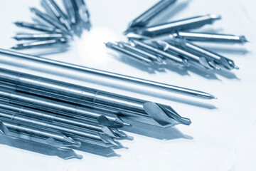 The group of various size of center drill on the white floor. The hi-speed cutting tool for hole processing.