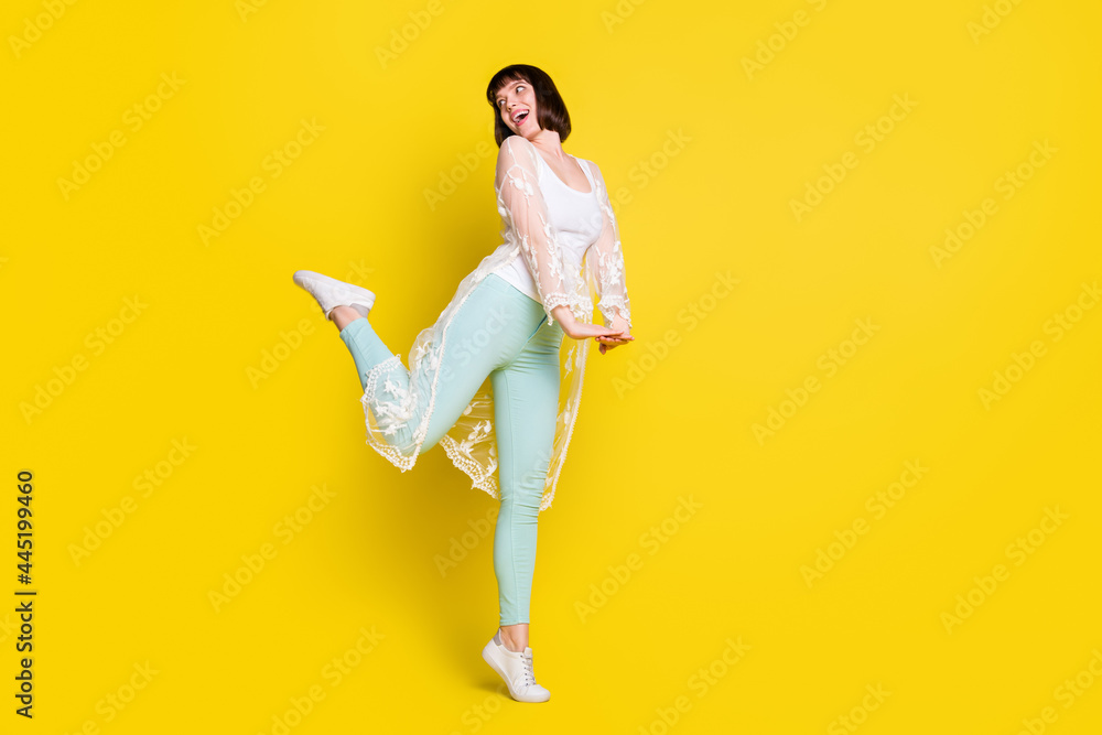 Canvas Prints Full body photo of cheerful nice young woman look empty space adorable isolated on yellow color background