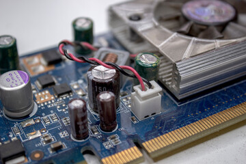 A microchip with components in close-up. Processor with resistors, transistors and chip components