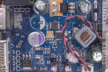 A microchip with components in close-up. Processor with resistors, transistors and chip components