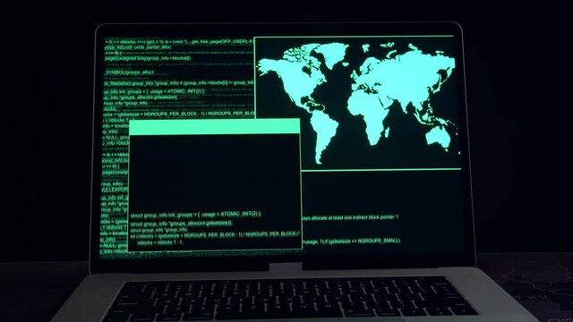 Hacker Concept. Code On A Laptop Computer Monitor In A Dark Room
