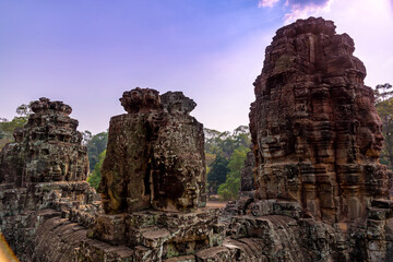 Stone Reliefs head on towers at the Bayon Temple in Angkor Thom