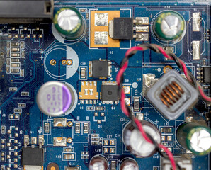 A microchip with components in close-up. Processor with resistors, transistors and chip components