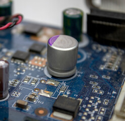 A microchip with components in close-up. Processor with resistors, transistors and chip components