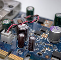 A microchip with components in close-up. Processor with resistors, transistors and chip components