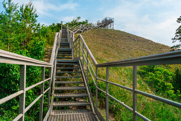 Stairs in the forest in the mountains. Beautiful natural landscape of Russia near the Volga River.