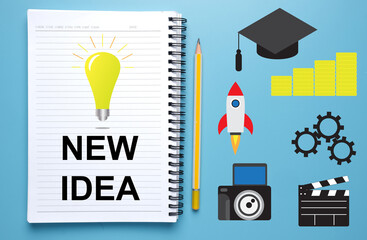 Bulb icon and New Idea word on notepad. Rocket, mortar, gear, clapperboard and camera. Creativity and new idea concept