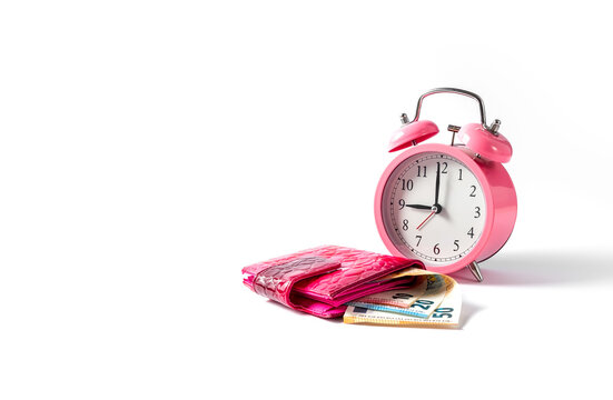 Alarm clock and wallet with euro money on a white background. Time is money concept. Copy space. Close up.