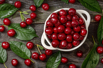 Cherry. Fresh sweet cherries bowl with leaves on wooden desktop table. water drops on Fresh sour cherry berries