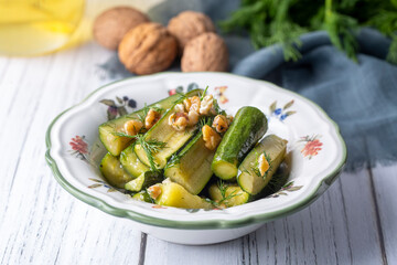 Green zucchini salad with walnuts and dill