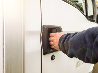 A man hand opening door on the truck