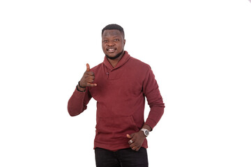 young man making mobile phone gesture with his fingers smiling.