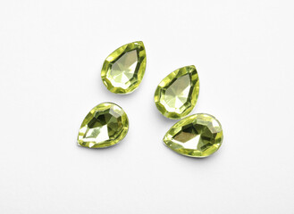 Beautiful gemstones on white background, top view
