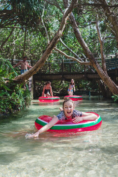 teens floating down Eli Creek, Fraser Island